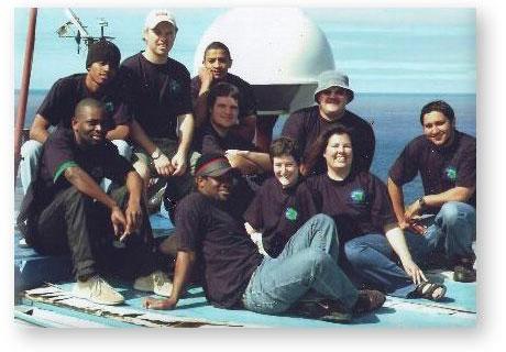 GOUGH 51 (2005-2006): Back (L-R) Menthiam Sebesho (Senior Meteorologist/Deputy Leader), Phillip Lourens (Meteorologist), Floyd Chubane (Radio Technician); Middle: Steven Phakula (Meteorologist), Johnny Wilson (Biologist), Fanie Potgieter (Diesel Mechanic); Front: Given Moreku (Sagina), Marie Burle (Biologist), Tamara Spinks (Medic/Leader), Ivan Green (Sagina).