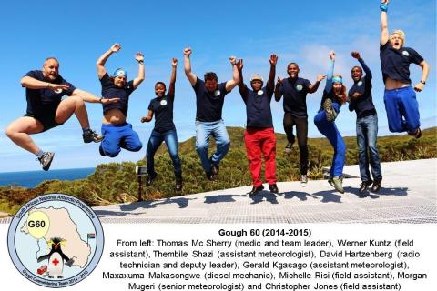 GOUGH 60 (2014-2015): (L-R) Thomas Mc Sherry (Medic/Team leader), Werner Kuntz (Field Assistant), Thembile Shazi (Assistant Meteorologist), David Hartzenberg (Radio Technician/Deputy Team Leader), Gerald Kgasago (Assistant Meteorologist), Maxaxuma Makasongwe (Diesel Mechanic), Michelle Risi (Field Assistant), Morgan Mugeri (Senior Meteorologist), Christopher Jones (Field Assistant).