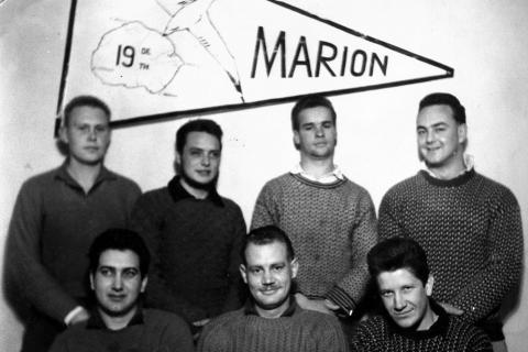 MARION 19 (April 1962-March 1963): Back (L-R) Marais Fourie (Meteorologist), C. Len van der Ven (Radio Technician), Johan M. Franken (Meteorologist), Johan Horne (Medic); Front: E. Ray Statt (Radio Operator), Jan Nagel (Leader/Senior Meteorologist), Gert N. le Grange (Meteorologist).