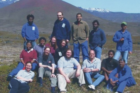 MARION 61 (2004-2005): Back (L-R) Hendrick Tshitsabane (Sealer), Edwald Ferreira (Radio Technician), Shallin Abrahams (Aphids), Justice Ramunasi (Sealer), Dumile Tshingana (Birder); Middle: Ziphokazi Buwa (Cushion Plants), Tsholo Naledi (Junior Meteorologist), Mariette Bause (Disturbance Study), Liz Turner (Birder); Front: Riana Viljoen (Medical Orderly/Team Leader), David Henning (Geomorphologist/Deputy Leader), Bjorn Perks (Senior Meteorologist), Chris Swanepoel (Diesel Mechanic), Abner Matlala (Junior Meteorologist), Kamva Qwede (Spiders).