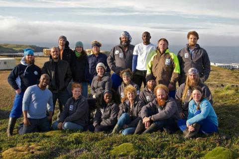 MARION 67 (2010-2011): Back (L-R) Simon Avis (Medic/Team Leader), Barend van der Merwe (Geomorphologist), Greg McClolland (CIB Ecologist), Kari Schoombee (Geo-Space Engineer), Chris Oosthuizen (MRI Sealer), Pierre Tromp (Radio Technician), Allen Tshautshau (CIB Ecologist), Gerhard Laubscher (Base Engineer), Cobus Cronje (Senior Meteorologist); Middle Row L-R: Jacqui Davis (Geomorphologist), Andries Botha (Meteorologist), Vince Rademeyer (Diesel Mechanic/Deputy Team Leader), Tristan Scott (MRI Sealer); Front Row L-R: Karabo Mokwena (Meteorologist), Mia Cerfonteyn (PFIAO Birder), Yolokazi Galada (Oceans & Coasts Birder), Linda Clokie (Oceans & Coasts Birder/Conservation Officer), Hugh Purdon (MRI Sealer), Jean Purdon (MRI Sealer).