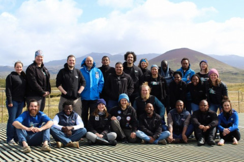 MARION 76 (2019-2020): Back (L-R) Laurie Johnson (Field Assistant – Seabirds), Samantha Schröder (Assistant Environmental Control Officer), Marius Rossouw (Assistant Meteorological Technician & Team Leader), Brent Misrole (Chef), Thabo Maroga (Base Engineer & Deputy Team Leader), Alain (AJ) Jacobs (Diesel Mechanic), Gerard (Boy) Oppel (Senior Meteorological Technician), Nita Pallett (Field Assistant – Physiology), Winnie Moodaley (Medical Orderly), Vumboni Msimango (Field Assistant – Sealer), Wendy Maiwashe (Field Assistant – Botany), Makabongwe Sigqala (Field Assistant - MAPRU Seabirds), Sithembile Mbonambi (Assistant Meteorological Technician), Jenna van Berkel (Field Assistant – Botany), Melissa Schulze (Field Assistant - MAPRU Seabirds); (front): Tavis Dalton (Fiels Assistant - Killer Whaler & Sealer), Arthur Mabunda (Electronics Engineer, SANSA), Janine Schoombie (Field Assistant - Wind Ecology), Stefan Schoombie (Field Assistant – Seabirds), Sean Evans (Field Assistant – Sealer), Lefa Morake (Field Assistant – Geomorphology), Aphiwe Dyum (Radio Technician), Mntambo Nakwa (Environmental Control Officer), Jelena Reljic (Field Assistant – Seabirds).