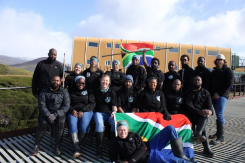 MARION 78 (2021-2022): (L-R) Back: Rodney Phoko Matjomane (Diesel Mechanic), Danielle Conry (Field Assistant: Killer Whaler/Sealer), Frikkie van der Vyver (Field Assistant: Sealer), Charles Thomas (Base Engineer), Siwe Khoza (Radio Technician), Yinhla Shihlomule (Field Assistant: Sealer), Thando Cebekhulu (Field Assistant: O&C Seabirds), Zenande Kabase (Field Assistant: Geomorphology), Tlhoholofatso (Steve) Tebele (Assistant Meteorological Technician), DJ Van Wyk (SANSA Engineer and Science Team Leader); (middle) Sanele Mkhonza (Environmental Control Officer), Fanisa Phakula (Assistant Meteorological Technician), Isabel Micklem (Field Assistant: Seabirds), Nivek Ghazi (UKZN Astrophysics Engineer), Siyasanga Mpehle (Senior Meteorological Technician and Deputy Team Leader), Bubele Nongwejana (Medical Orderly and Team Leader), Sydney Tshilingalinga (Assistant Environmental Control Officer); (front) Eleanor Weideman (Field Assistant: Seabird Conservation).